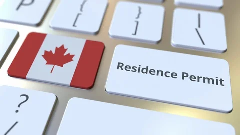 Residence Permit text and flag of Canada on the buttons on the computer keyboard Stock Footage 122995998