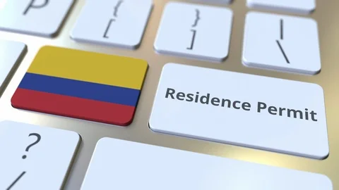 Residence Permit text and flag of Colombia on the buttons on the computer Stock Footage 122997971