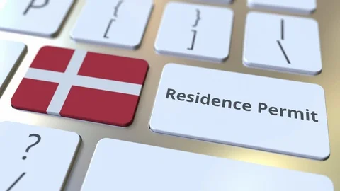 Residence Permit text and flag of Denmark on the buttons on the computer Stock Footage 122999092