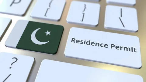 Residence Permit text and flag of Pakistan on the buttons on the computer Stock Footage 123015401