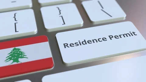 Residence Permit text and flag of Lebanon on the buttons on the computer Stock Footage 123015775