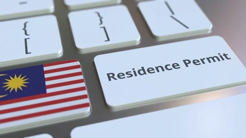 Residence Permit text and flag of Malaysia on the buttons on the computer Stock Footage 123015891