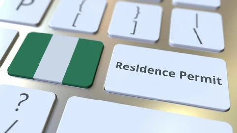 Residence Permit text and flag of Nigeria on the buttons on the computer Stock Footage 123016212