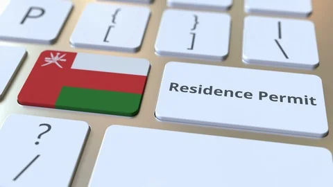 Residence Permit text and flag of Oman on the buttons on the computer keyboard Stock Footage 123016566