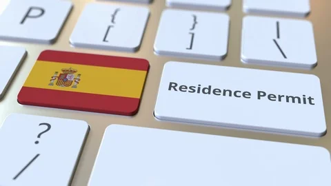 Residence Permit text and flag of Spain on the buttons on the computer keyboard Stock Footage 123047159