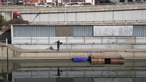 A resident dancing on a spring day in central Beijing Stock Footage 234388575