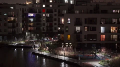 Residential apartment building complex illuminated at night in city district Stock Footage 337544758