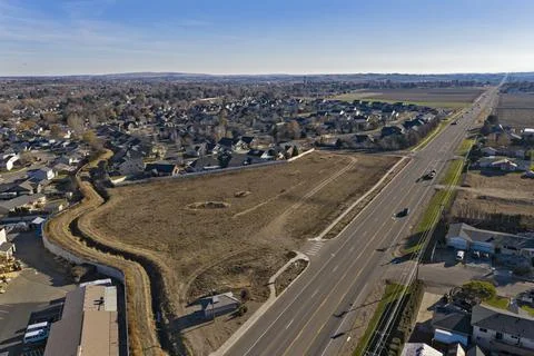 Residential Area With Empty Land Main Road in Nampa, Idaho Stock Photos