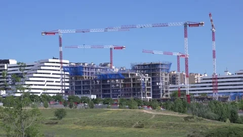 Residential building construction with tower cranes 스톡 동영상 335484932