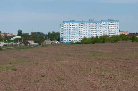 Residential building from the developer, new building in the field. Facade in 스톡 사진