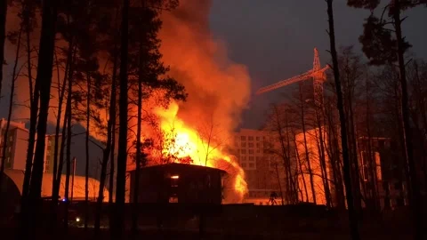 A residential building is on fire at night.  Stock Footage 165241403