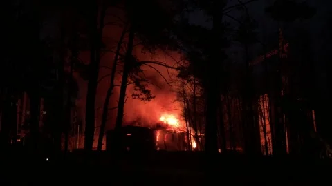 A residential building is on fire at night.  Stock Footage 165241404