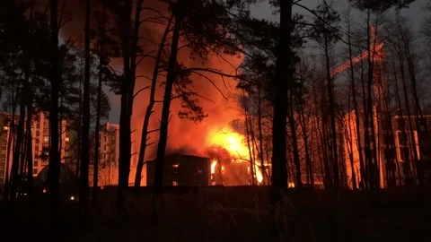 A residential building is on fire at night.  Stock Footage 165241424