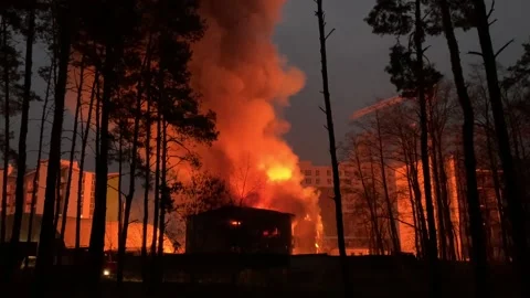 A residential building is on fire at night.  Stock Footage 165241425