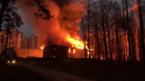 A residential building is on fire at night.  Stock Footage 165241440