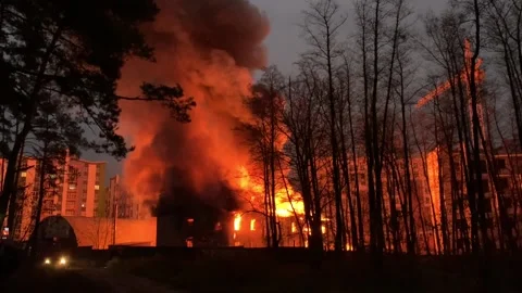 A residential building is on fire at night.  Stock Footage 165241461