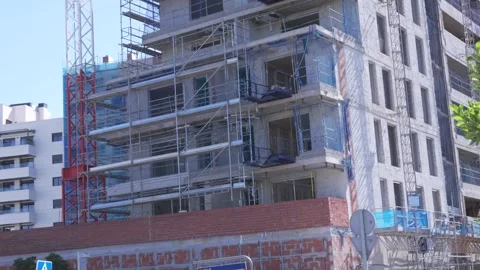 Residential building under construction with scaffolding Stock Footage 335484945