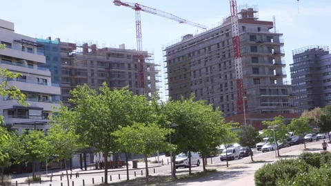 Residential buildings under construction with tower cranes Stock Footage 335484949