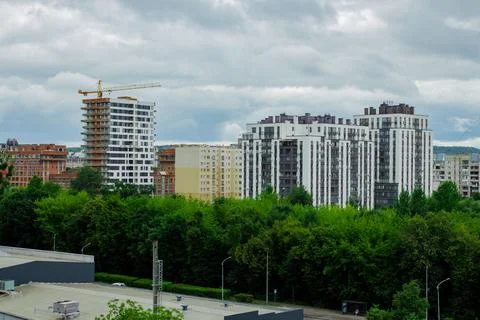 Residential complex under construction with big crane on site. New aparments  Stock Photos