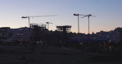Residential construction cranes at blue hour in Madrid 스톡 동영상 336861083