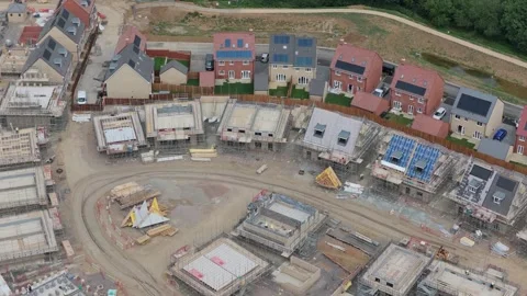 Residential Construction Site Progress Featuring Newly Built Houses and Homes Stock Footage 342771594