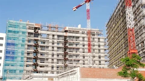 Residential Construction Site with Tower Cranes and Scaffolding in Madrid Stock-Footage 336012630