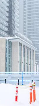 Residential district on the final stage of construction under snow fall Stock Photos