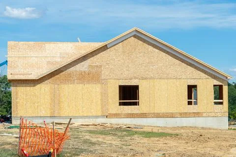 A residential duplex house construction project showing the plywood roof and  Stock Photos