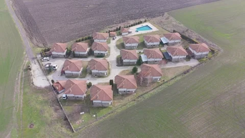 Residential Housing Complex Surrounded by Wide Farmland Fields Stock Footage 328827336