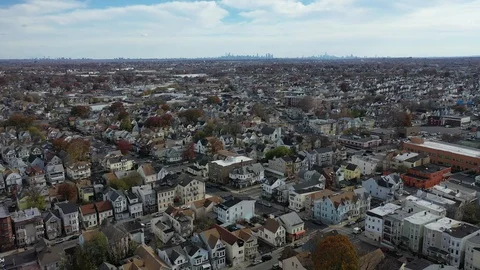 Residential rooftops and far Manhattan skyline, Paterson New Jersey Stock Footage 98319336