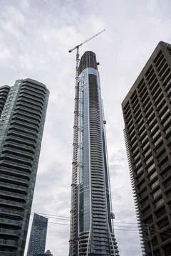 Residential Skyscraper Under Construction Between Downtown Toronto Buildings Stock Photos