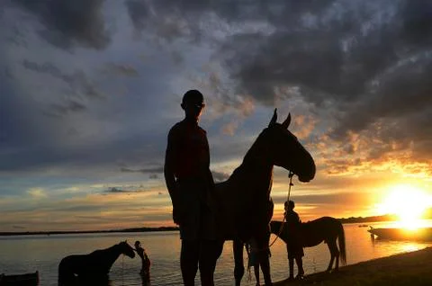 Residents and their horses in the São Francisco River Stock Photos