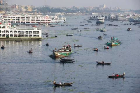Residents of Dhaka cross Buriganga river by boats, Dhaka, Bangladesh. Stock Photos