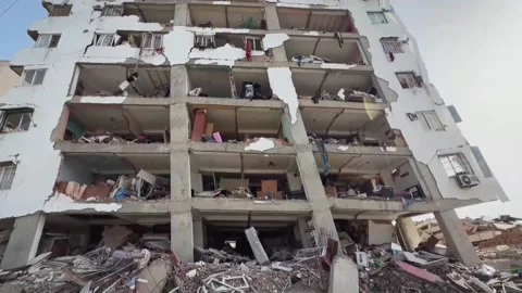 Residents of La Guaira continue to work together to find people trapped in the r Stock Footage 337724619