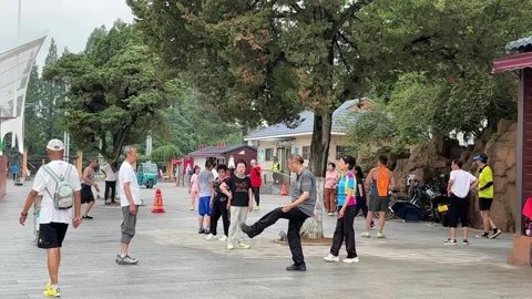 Residents Practice Morning Exercise in a Public Square in Dandong Stock Footage 340175979