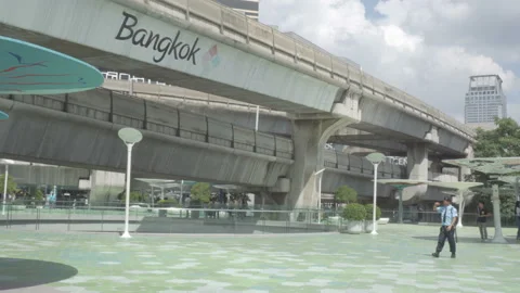 Residents walking along the Pathumwan Intersection Skywalk Stock Footage 99131377