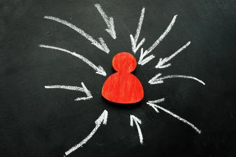 Resilience and assertiveness concept. Red figurine and arrows. Stock Photos
