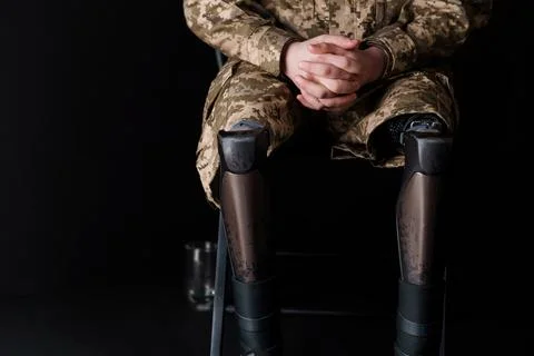 Resilient Soldier with Advanced Bionic Leg Prosthesis in Military Camouflage Stock Photos