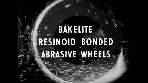 Resinoid bonded abrasive wheels are manufactured in a factory, in 1937. Stock Footage