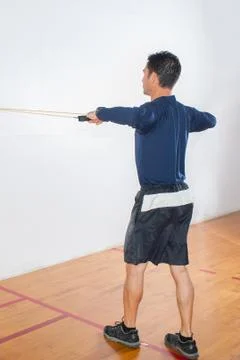 Resistance band exercise for shoulders Stock Photos
