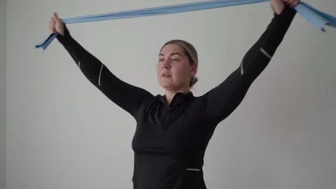 Resistance Band Pull-Apart for Shoulder Rehab and Posture Alignment Stock Footage 340545059