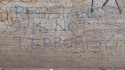 "Resistance is not terrorism" Graffiti Video stock 77590729