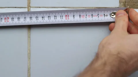 Resizing Tiles With a Tape Measure Stock Footage 36669350