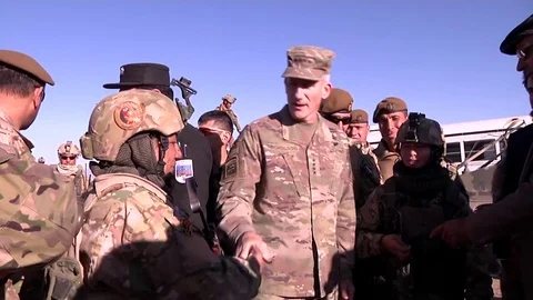 Resolute support commander shakes hands with female Afghan soldier Stock Footage 83033931