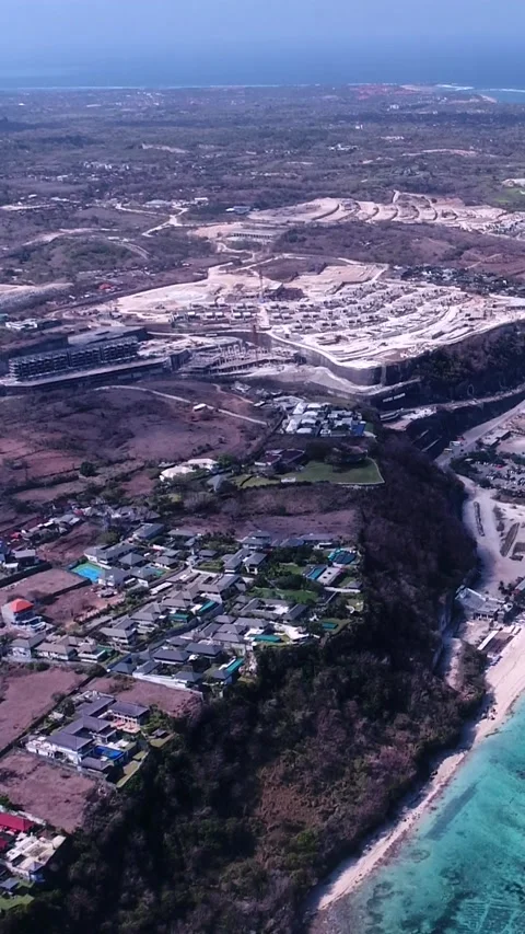 Resort on beach in front of shallow reef with turquoise water Stock Footage 230299205