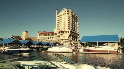 Resort boat into docks Stock Footage 49401488