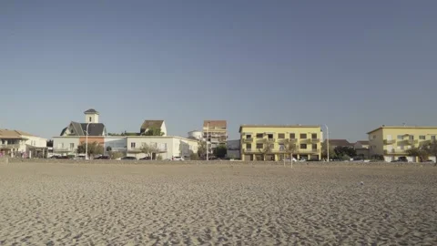Resort city buildings along the empty sandy beach coast Stock Footage 342446131