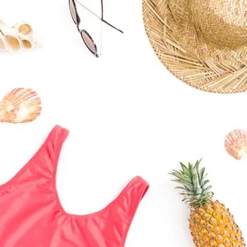 Resort composition of pineapple fruit, sun glasses, straw hat and bikini swim Stock Photos
