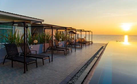 Resort  in front beach at sunset Stock Photos