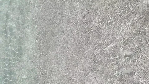 Resort Getaway: Walking to the Waves Stock Footage 240402469